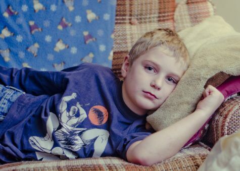 Boy laying on couch