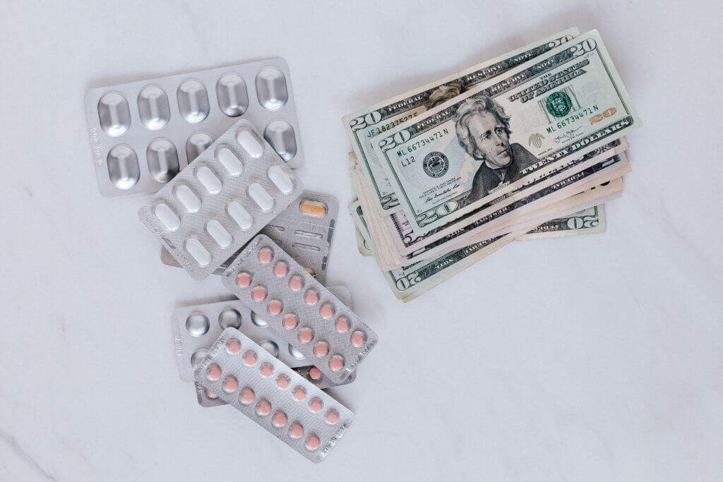 Money and prescription drug pills