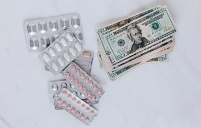 Money and prescription drug pills