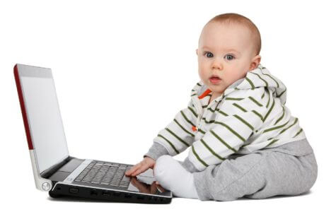 Baby playing with computer