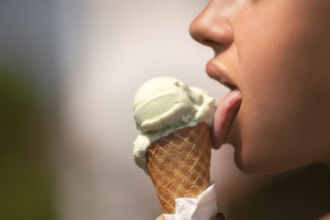Person licking ice cream cone
