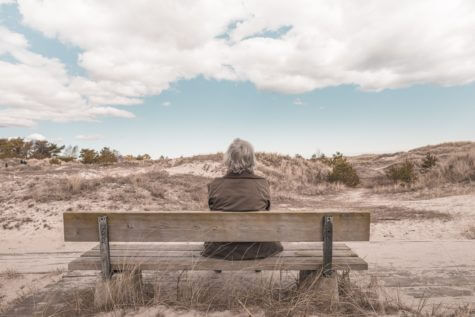 Elderly person sitting alone