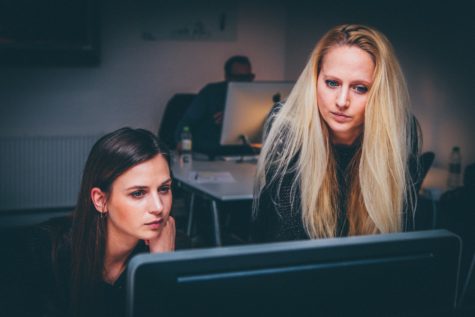 Women looking at computer in office