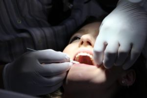 Woman being treated at dentist