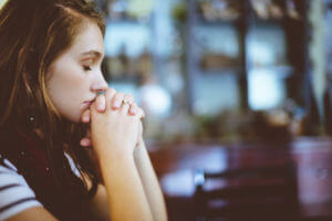 Woman thinking or praying