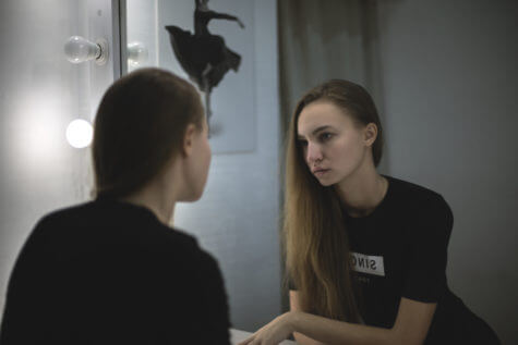 Woman looking at mirror