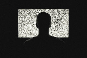 Person in front of static television