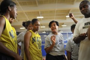 All-Navy women's basketball team assistant coach Diane Richardson mentors prospective players as they run through drills.