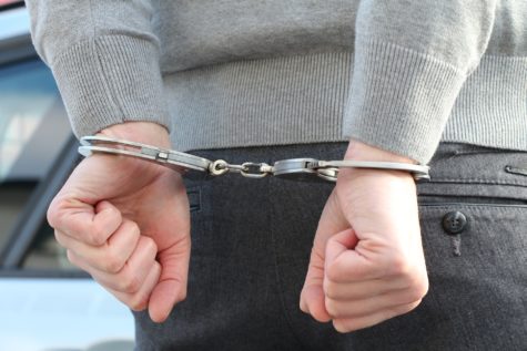 Handcuffed person under arrest