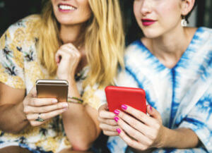 Young women using smartphones