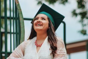 Latino woman celebrates graduating
