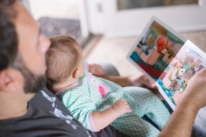 Father reading book to baby
