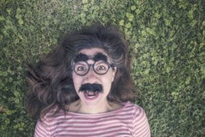 Woman wearing gag Groucho Marx glasses