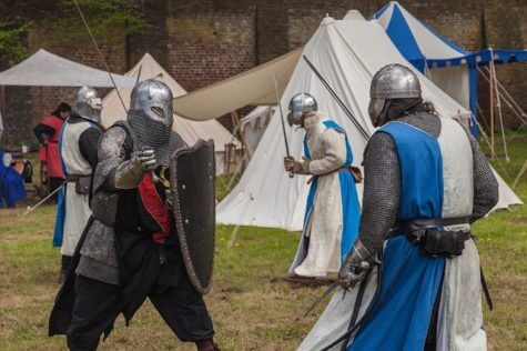Medieval knights hold a sword fight reenactment