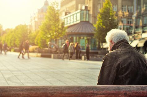 Elderly man sitting alone