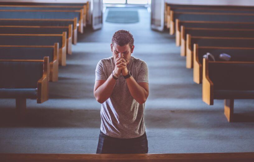 Man praying in church