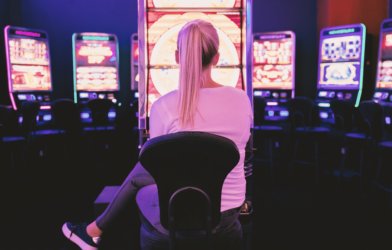 Woman in front of slot machine