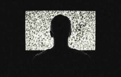 Person in front of television