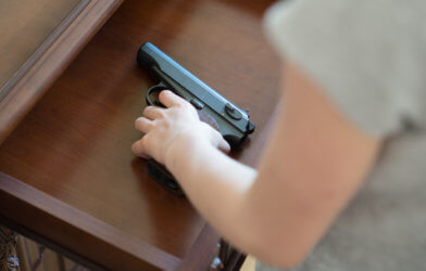 Child with gun in drawer