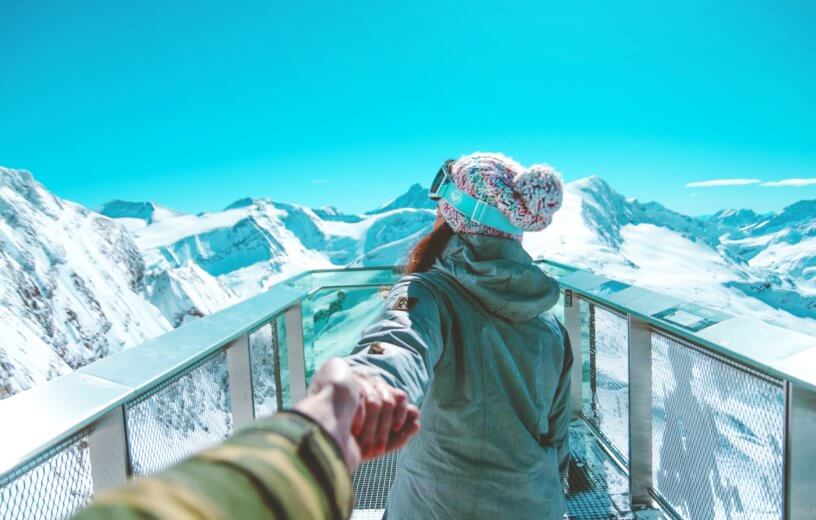Couple on snowy mountain
