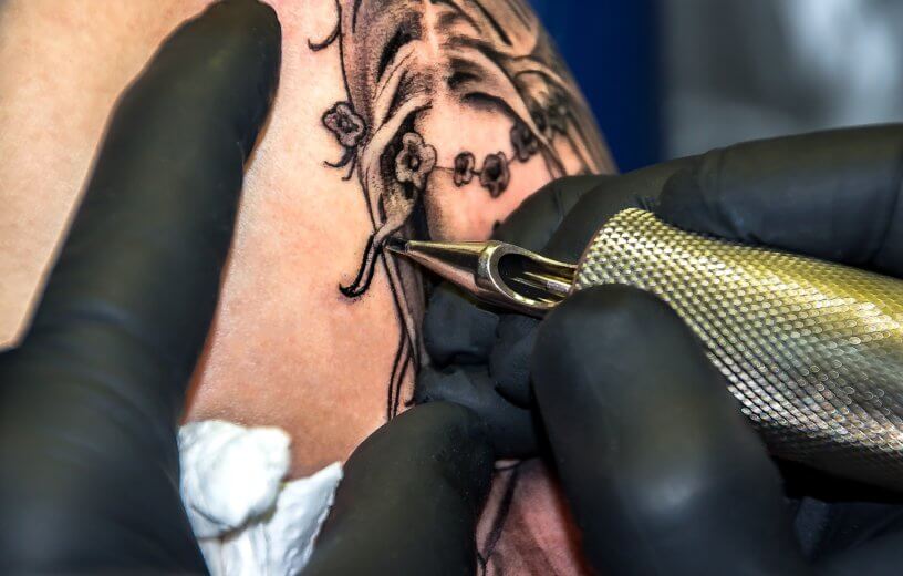 Person getting tattoo