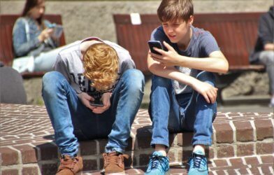 Teens using smartphones