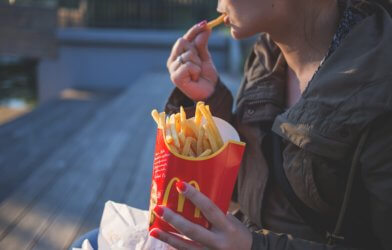 Woman eating McDonald's fries
