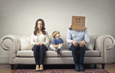 Mother with young son, Father with box on his head