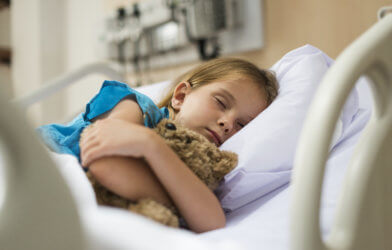 Young girl in hospital bed