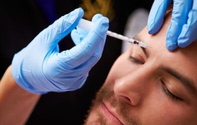 Man having Botox injection, cosmetic procedure