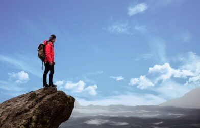 Man traveling alone atop mountain