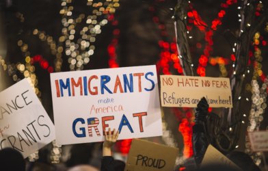 "Immigrants make America Great" sign held during immigration rally