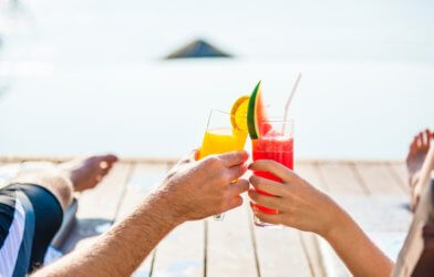 People toasting their drinks on vacation