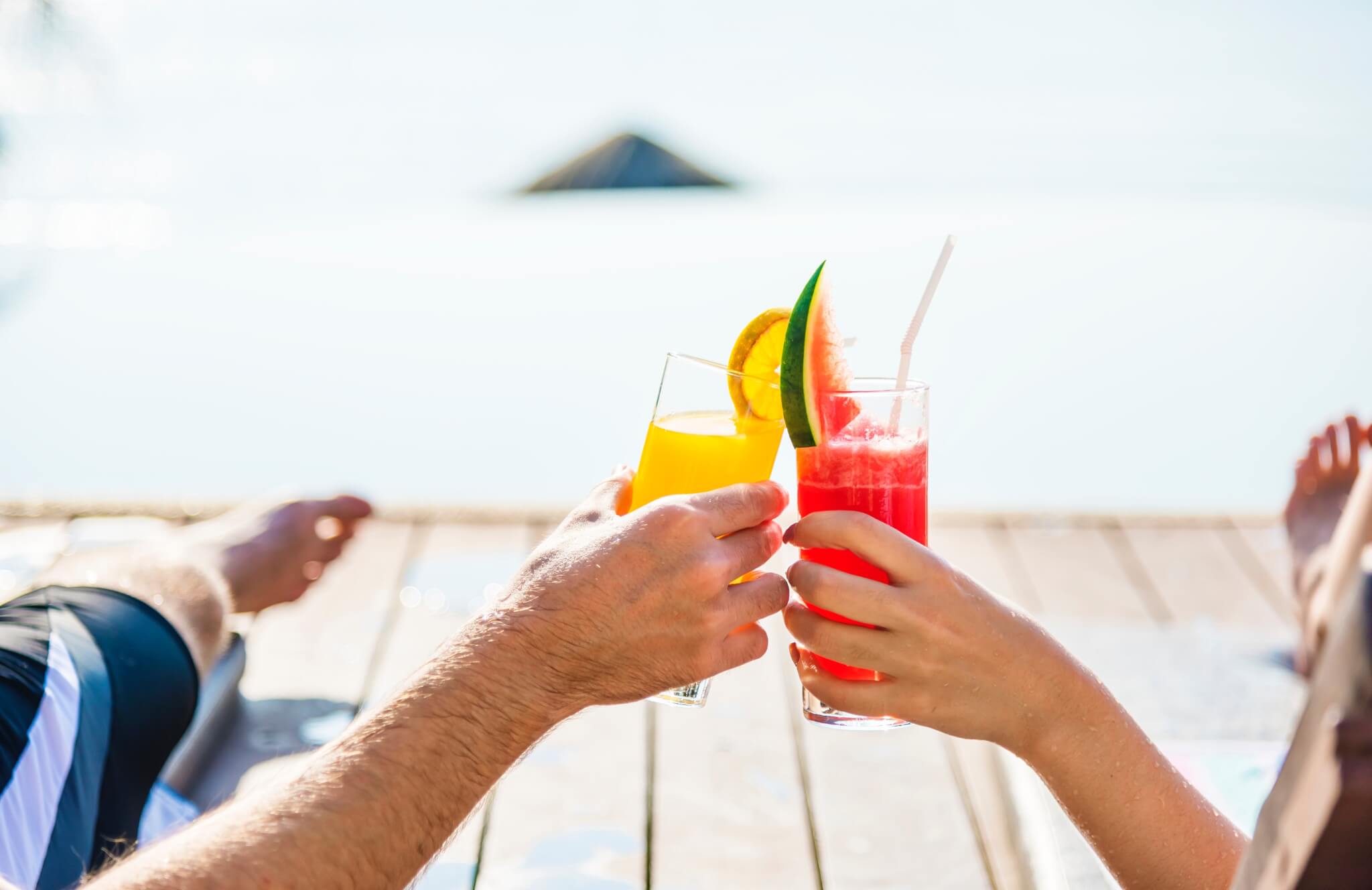 People toasting their drinks on vacation