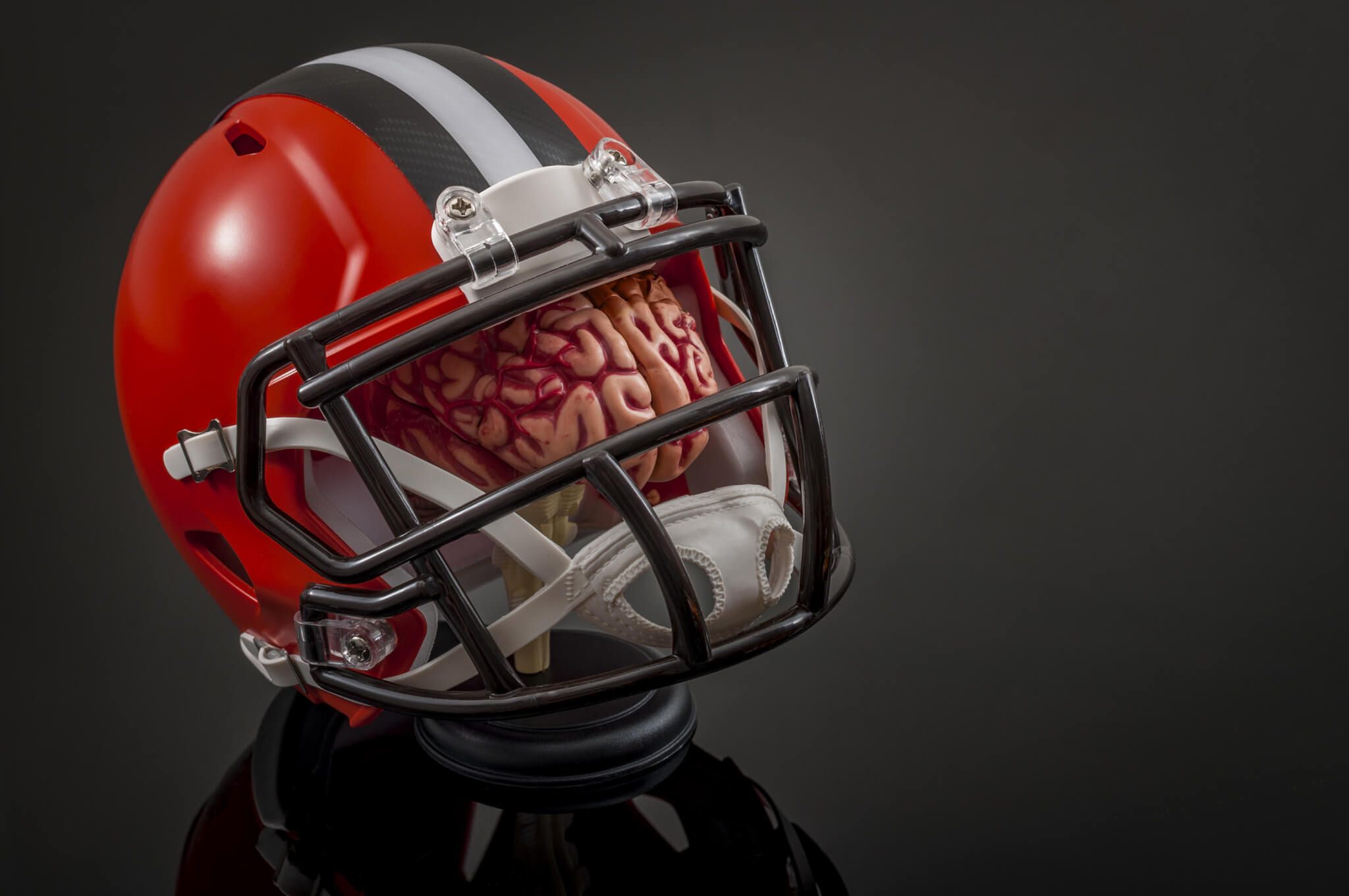 Football helmet over brain: concussions and head injuries