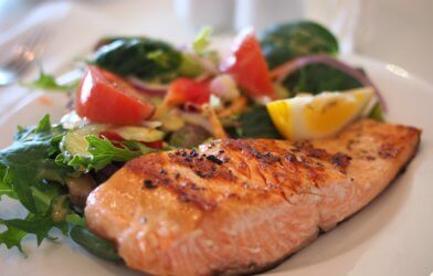 Salmon and vegetables on a dinner plate