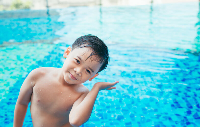 Young swimmer with water in his ear