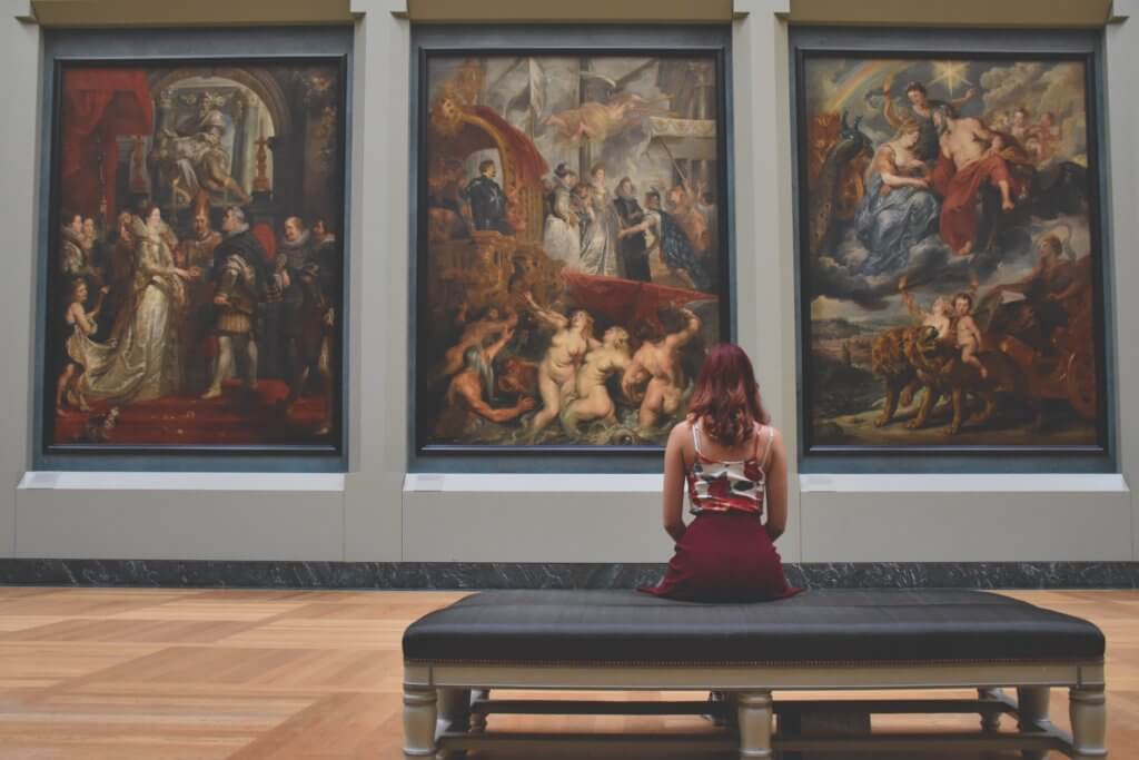 Woman sitting at art gallery or museum