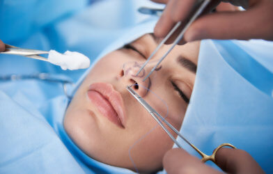 Woman undergoing rhinoplasty or "nose job"