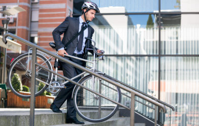 Businessman biking to work