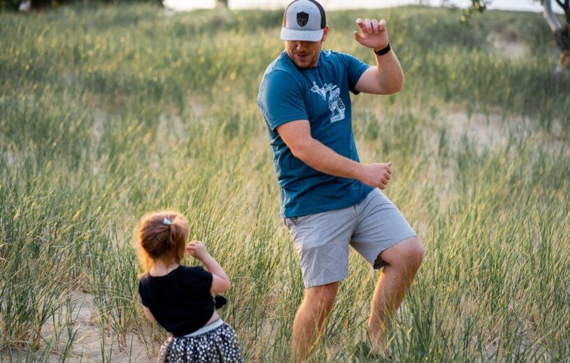 Father dancing with little girl