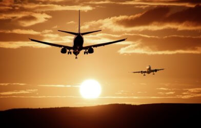 Commercial airplanes in sunset