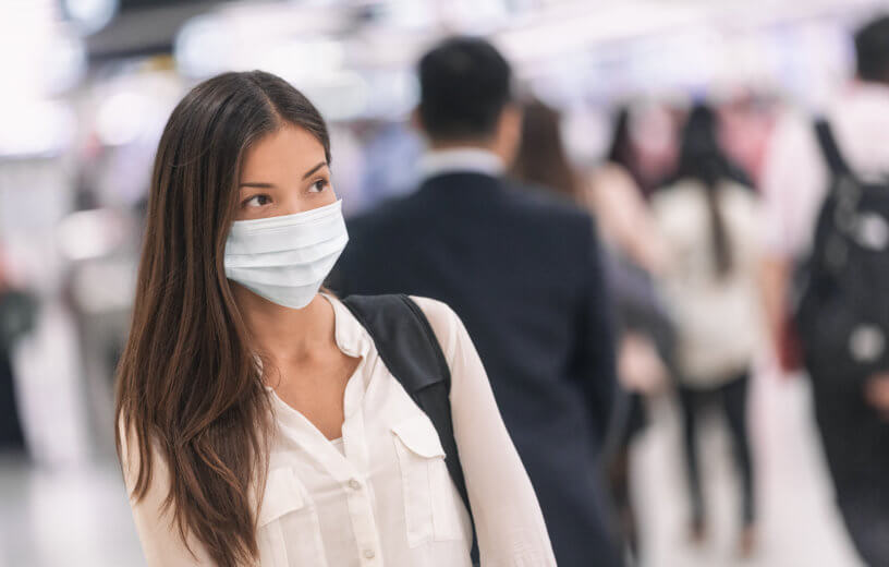 Woman wearing face mask at airport amid virus outbreak
