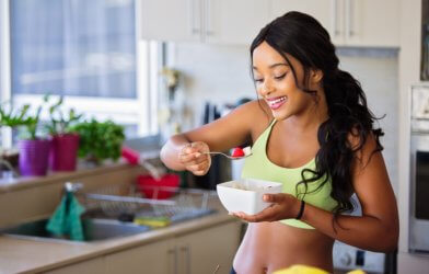 Woman eating healthy diet after exercising