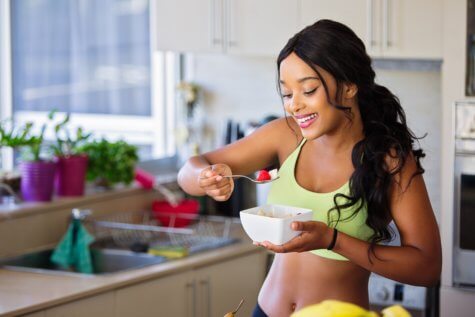 Woman eating healthy diet after exercising