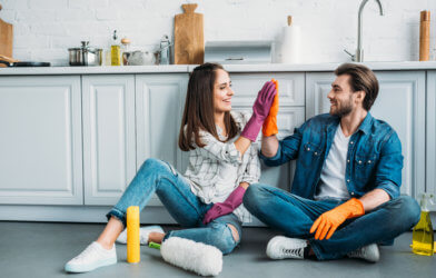 Couple doing house cleaning