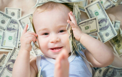 Baby laying in money