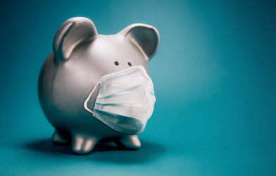 Piggy bank with face mask during coronavirus outbreak