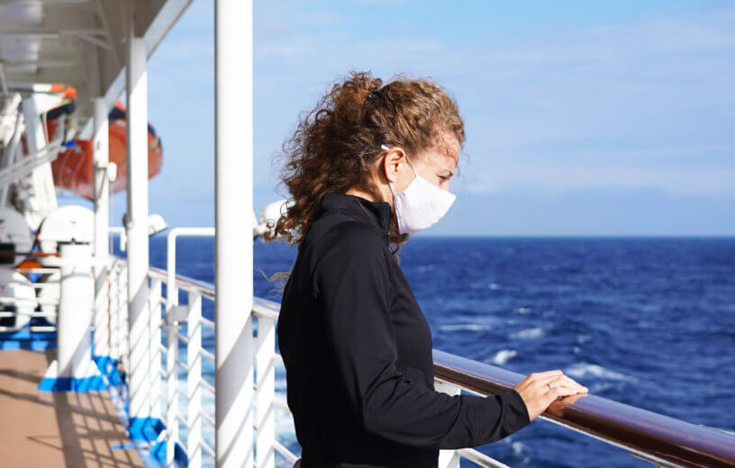 Woman wearing mask on cruise ship during coronavirus outbreak