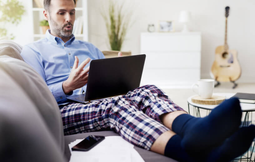 Man working from home in pajamas